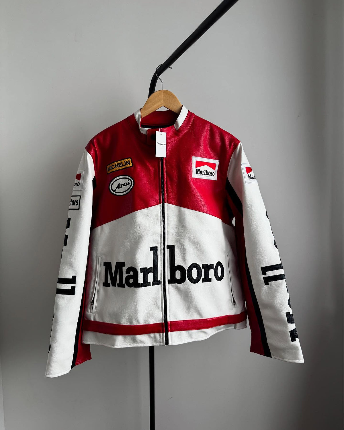 Marlboro F1 leather jacket front view with Michelin and Arai sponsor patches on red and white design