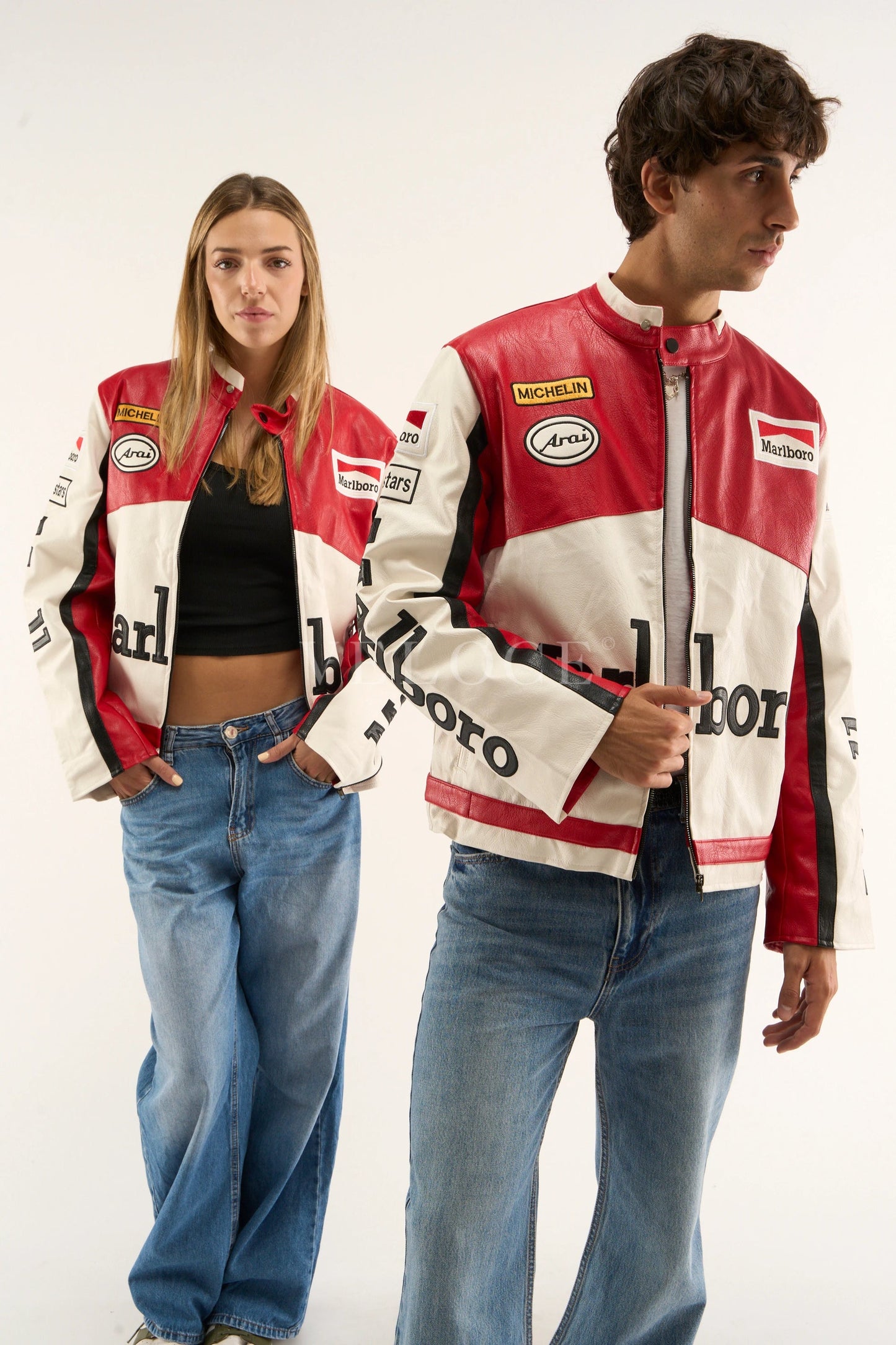 Two people wearing red and white Marlboro racing jacket branded jackets on a white background