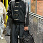 Men styling the oversized viral Black CNY Jacket Tang style from Gigavibe