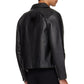 Side and back profile of the minimalist black leather moto jacket. Showcases exactly where the cropped hem hits the waistline to emphasize the oversized streetwear architecture, ensuring a perfect gender-neutral darkwear silhouette.