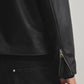 Macro close-up shot of the premium high-quality heavyweight faux leather matrix. Shows the highly detailed semi-matte grain finish completely devoid of cheap plastic shine, contrasted sharply by the stealthy metallic front zipper hardware.