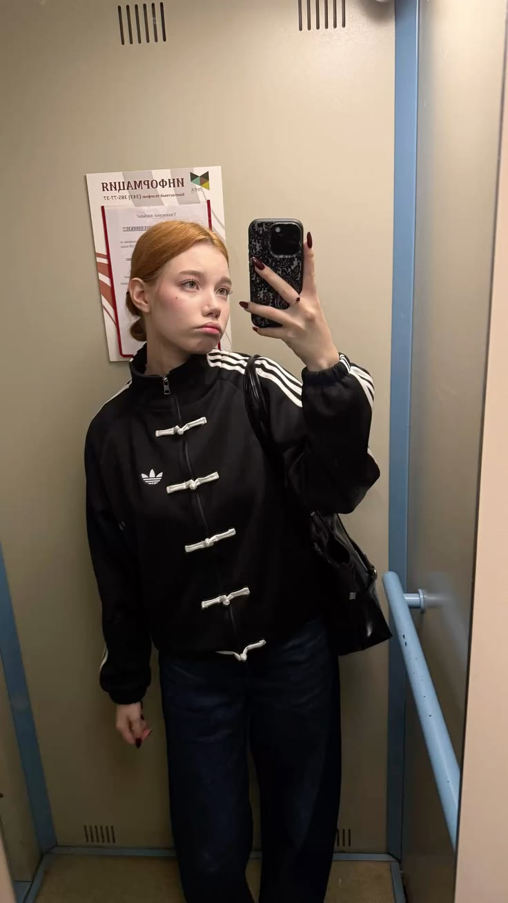 Women styling the oversized Black CNY Jacket in Tang style from Gigavibe
