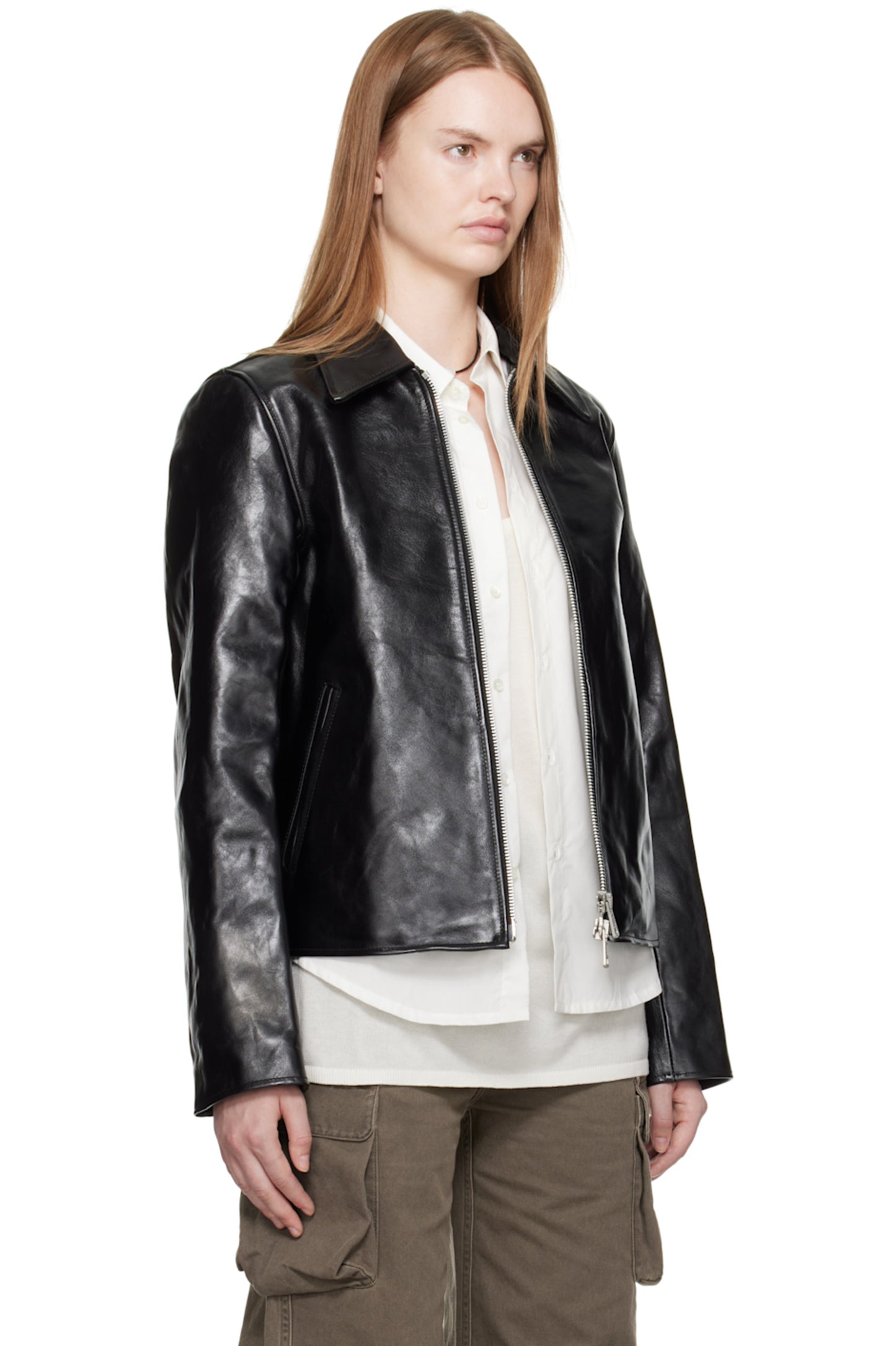 Angled 3/4 front view of the Y2K bikercore aesthetic black bomber. Highlights the wide structured shoulders, the clean pointed moto collar, and the total absence of loud branding for a truly clean aesthetic black jacket.